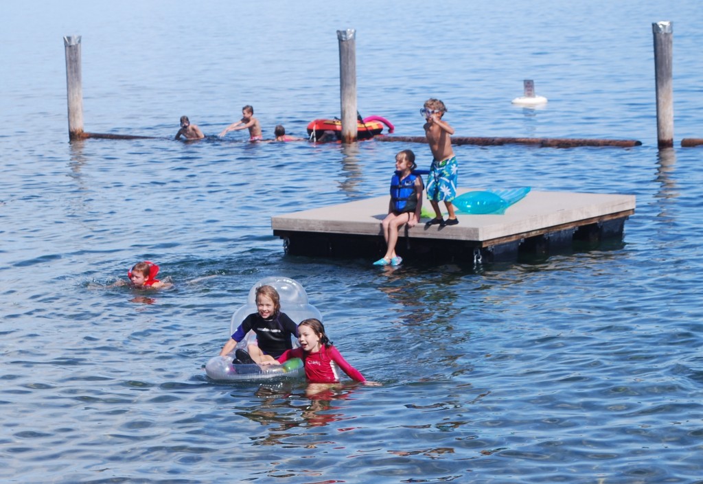 kids swimming at a lake