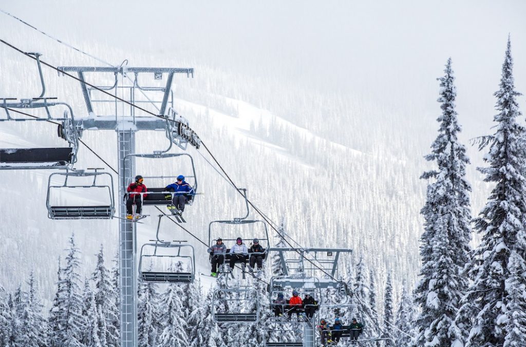 Skiers on the chairlift at Sun Peaks Resort. Photo Credit Destination BC/Ryan Creary